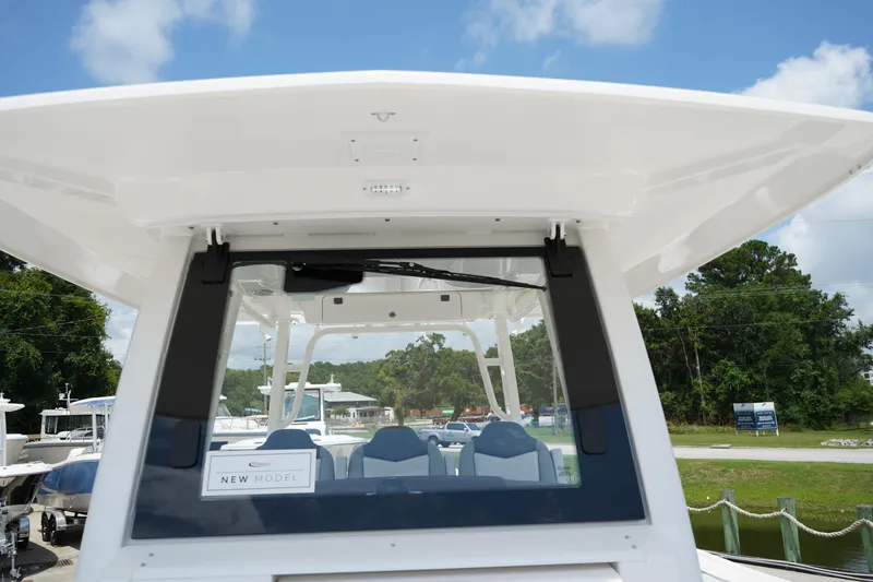 Slide: The Image of 2025 Robalo R300 Center Console boat, showcasing sleek design and modern features. - 48
