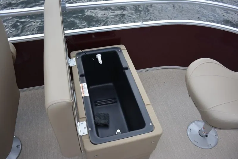 Slide: The Image of Starcraft 20 LX 2025 boat interior with open storage compartment and seating. - 16