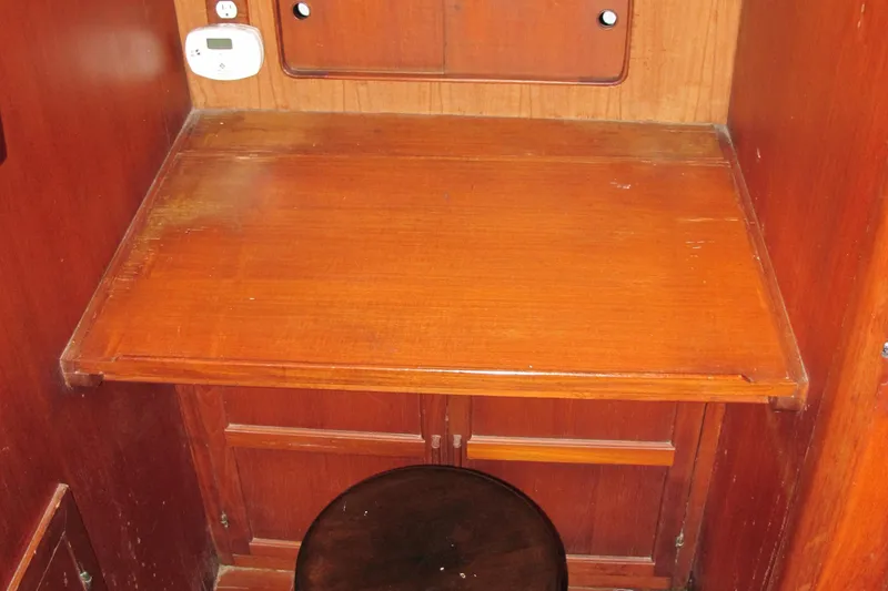 Slide: The Image of Wooden desk and stool inside a 1981 Albin 36 boat cabin. - 15