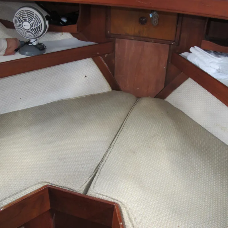 Slide: The Image of Interior cabin of a 1981 Albin 36 boat with beige cushions and wooden trim. - 23
