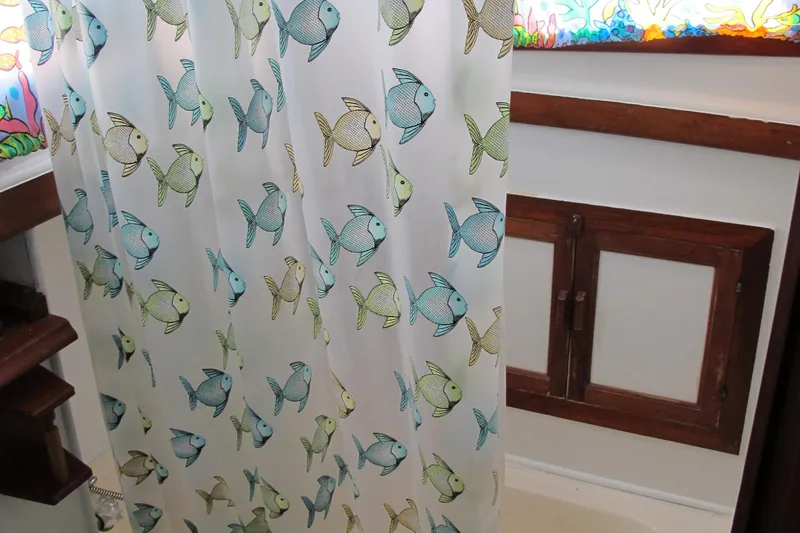 Slide: The Image of Shower curtain with colorful fish pattern in 1981 Albin 36 boat bathroom. - 28