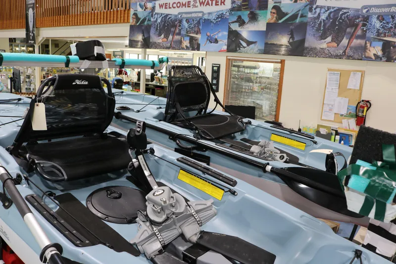 Slide: The Image of 2023 Hobie Mirage Passport 12.0 R kayaks displayed in a showroom setting. - 2
