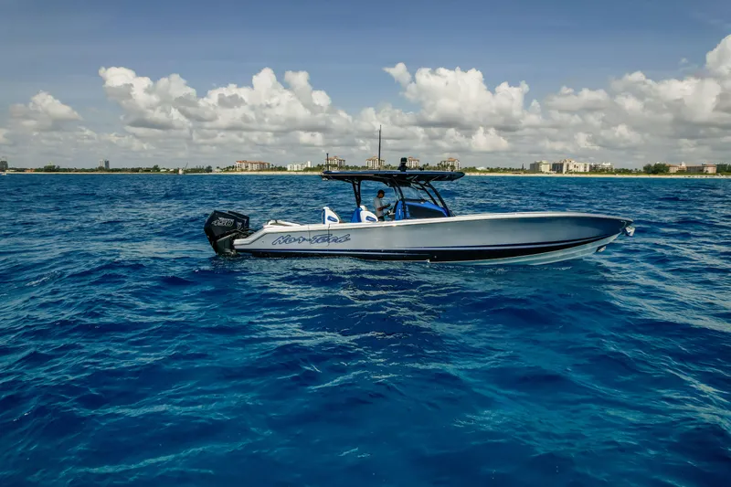 Slide: The Image of 2022 Nor-Tech 390 Center Console boat cruising on blue ocean waters. - 15