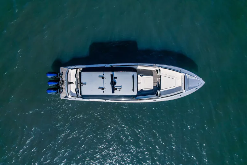 Slide: The Image of Aerial view of 2022 Nor-Tech 390 Center Console boat on water. - 22