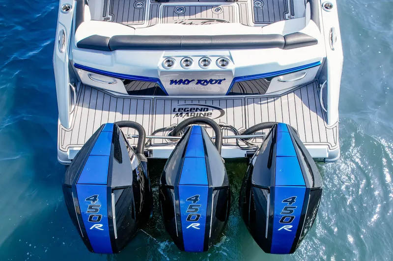 Slide: The Image of 2022 Nor-Tech 390 Center Console with triple 450R engines on water. - 5
