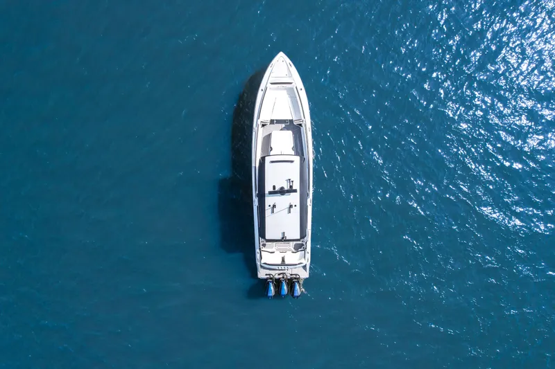 Slide: The Image of Aerial view of 2022 Nor-Tech 390 Center Console boat on blue water. - 6
