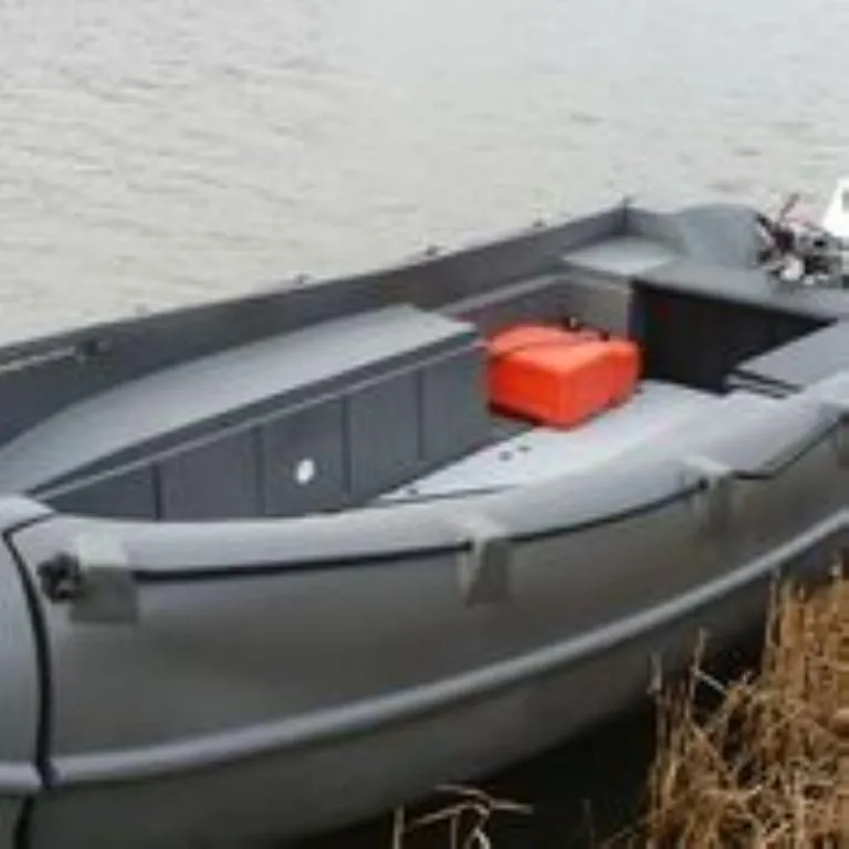 Slide: The Image of 2023 Whaly 455 R boat on water, featuring a sleek design and orange storage box. - 3