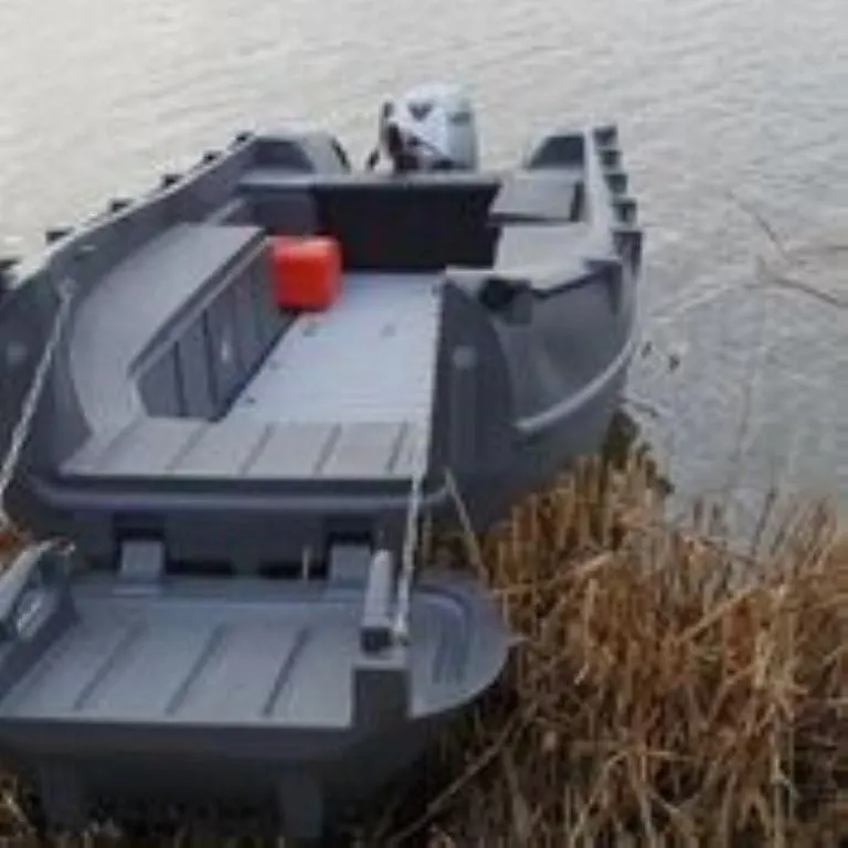 Slide: The Image of 2023 Whaly 455 R boat docked by the water's edge with a red fuel container. - 4