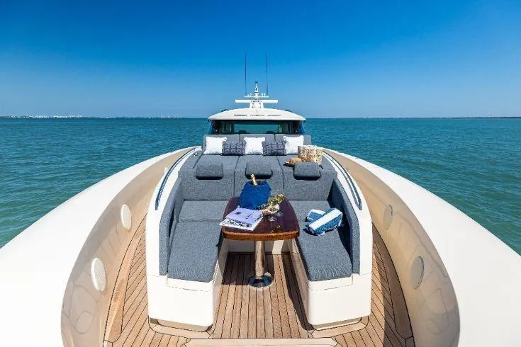 Slide: The Image of Luxurious 2026 Scout 670 LXS yacht with elegant deck seating on open water. - 12