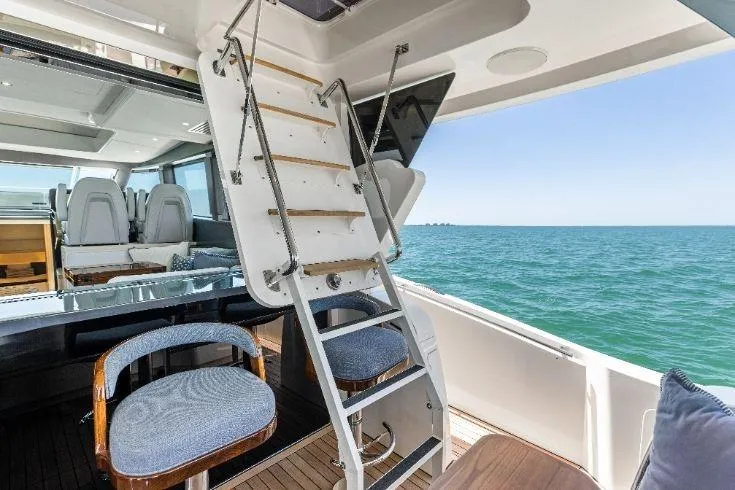 Slide: The Image of Luxury interior of 2026 Scout 670 LXS yacht with ocean view and seating area. - 30