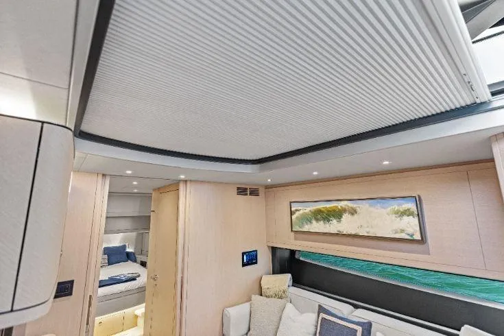 Slide: The Image of Luxurious interior of 2026 Scout 670 LXS yacht with modern design and cozy seating. - 50