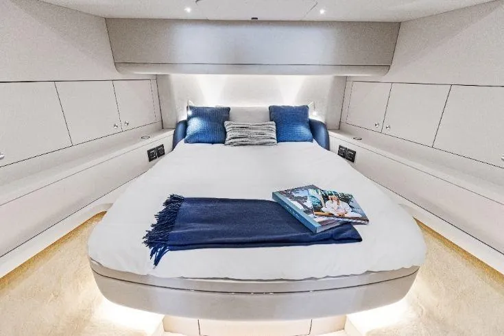 Slide: The Image of Luxurious 2026 Scout 670 LXS yacht cabin with cozy bed and elegant decor. - 51