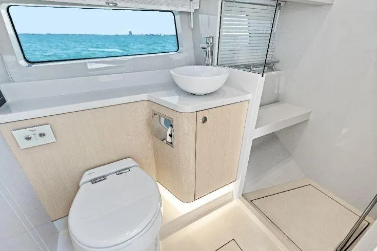Slide: The Image of Luxurious bathroom interior of 2026 Scout 670 LXS yacht with ocean view. - 56