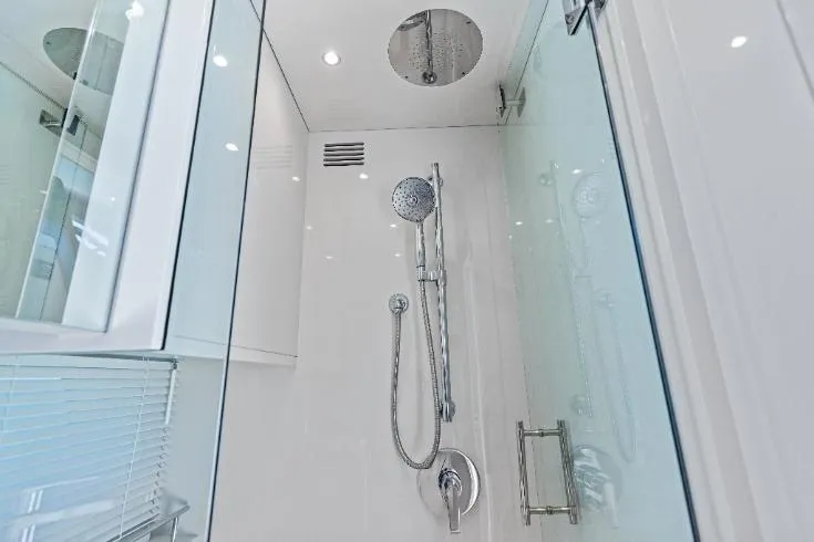 Slide: The Image of Modern shower in 2026 Scout 670 LXS yacht, featuring sleek chrome fixtures and glass enclosure. - 57