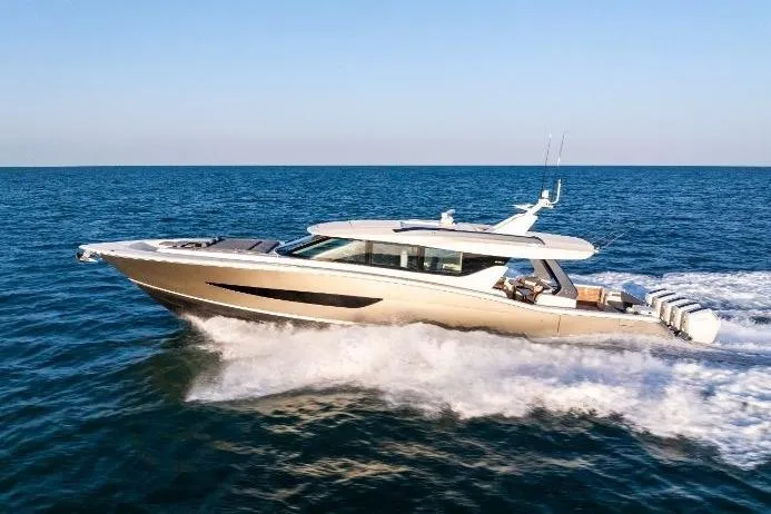 Slide: The Image of 2026 Scout 670 LXS luxury yacht cruising on open sea under clear blue sky. - 7
