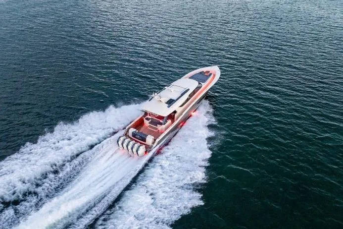 Slide: The Image of Aerial view of 2026 Scout 670 LXS boat cruising on open water. - 8