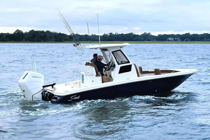 The Image of 2026 Scout 261 XSS boat displayed outdoors at Emerald Coast Marine. - 0