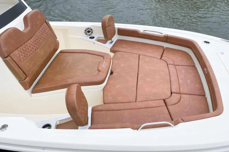 Slide: The Image of 2026 Scout 261 XSS boat with Mercury engine displayed outdoors. - 3