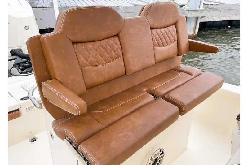 Slide: The Image of 2026 Scout 261 XSS boat interior with cushioned seating and Garmin equipment. - 5