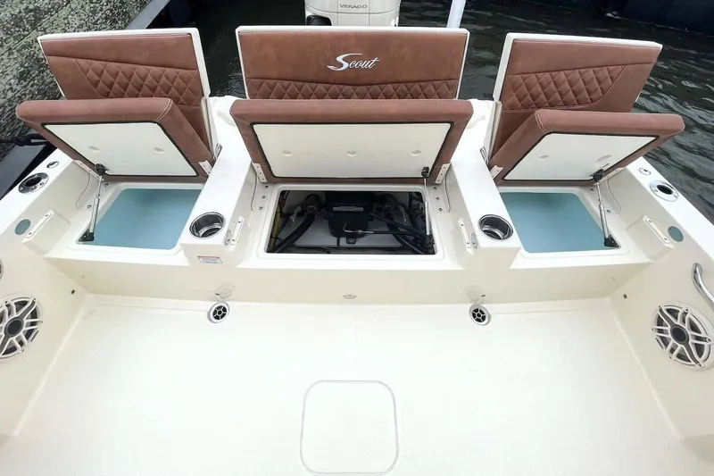 Slide: The Image of Open storage compartment on 2026 Scout 261 XSS boat, showcasing interior space. - 8