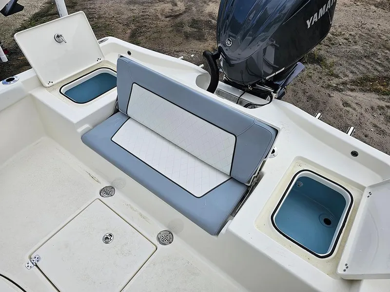 Slide: The Image of Avenger AV26 2025 boat interior with seating and storage compartments. - 10