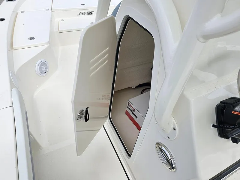Slide: The Image of 2025 Avenger AV26 boat storage compartment with open door, showcasing interior space. - 20