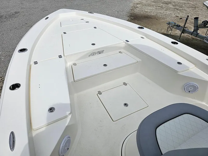 Slide: The Image of 2025 Avenger AV26 boat deck with storage compartments and seating. - 21