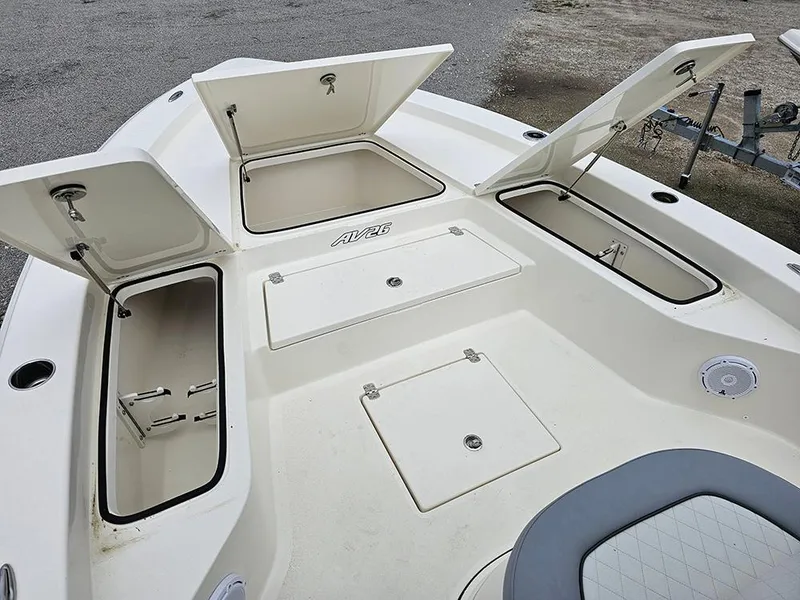 Slide: The Image of 2025 Avenger AV26 boat deck with open storage compartments. - 24