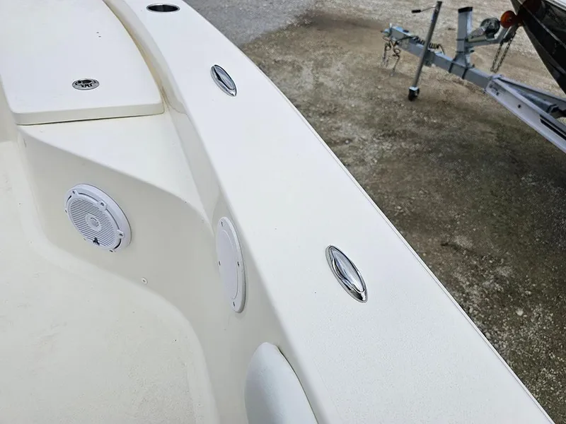 Slide: The Image of Avenger AV26 2025 boat interior with speakers and trailer in background. - 25