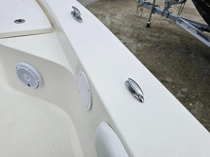 Slide: The Image of 2025 Avenger AV26 boat deck with speakers and cleats. - 26