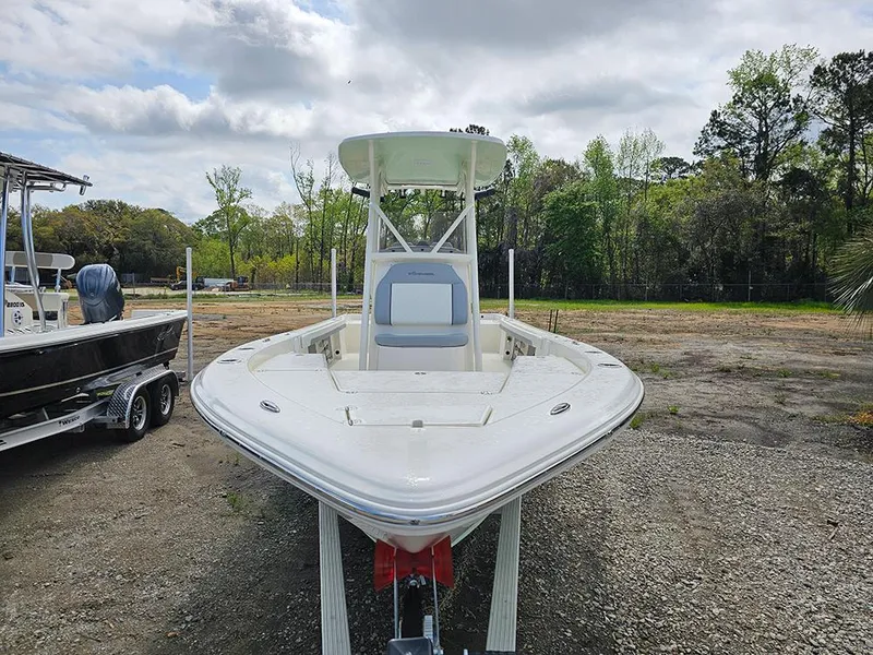 Slide: The Image of 2025 Avenger AV26 boat on trailer, parked outdoors with trees in background. - 3