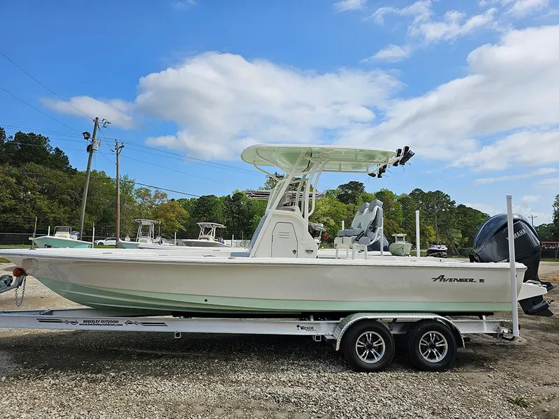 Slide: The Image of 2025 Avenger AV26 boat on trailer under blue sky. - 5