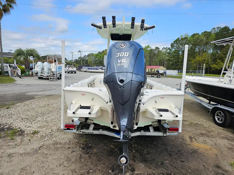 Slide: The Image of 2025 Avenger AV26 boat with powerful 300 V6 engine, parked on a trailer. - 7