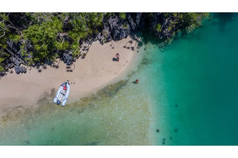 Slide: The Image of Aerial view of beach with Highfield UltraLite 290LT boat, 2024 model. - 7