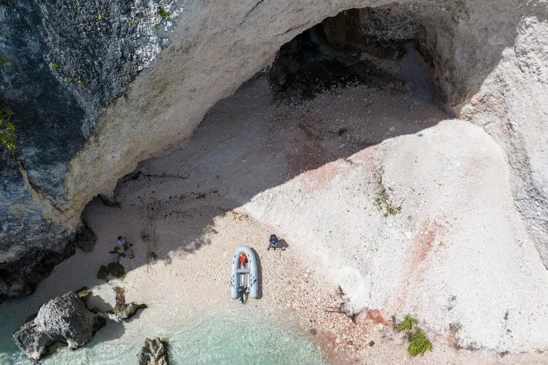 Slide: The Image of Aerial view of Highfield UltraLite 290LT boat on a rocky shoreline. - 8