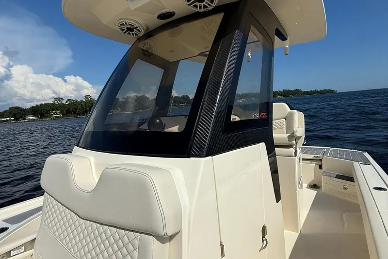 Slide: The Image of 2026 Scout 281 XSS boat on water, featuring sleek design and modern amenities. - 14