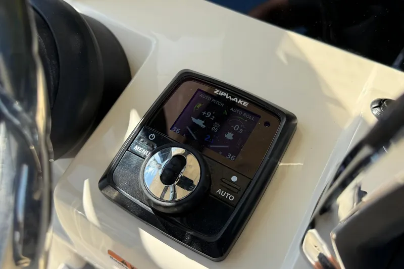 Slide: The Image of Zipwake control panel on 2026 Scout 281 XSS boat dashboard. - 17