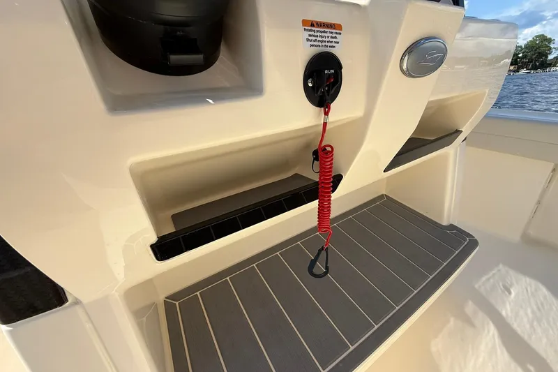 Slide: The Image of 2026 Scout 281 XSS boat interior with safety features and storage compartments. - 18