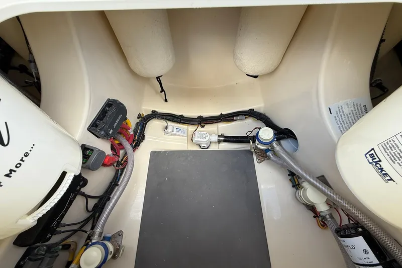 Slide: The Image of 2026 Scout 281 XSS boat interior showing wiring and components. - 31