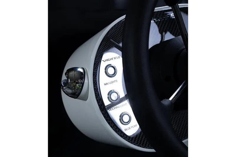 Slide: The Image of 2024 Highfield Classic 310 FCT dashboard with control buttons and steering wheel. - 6
