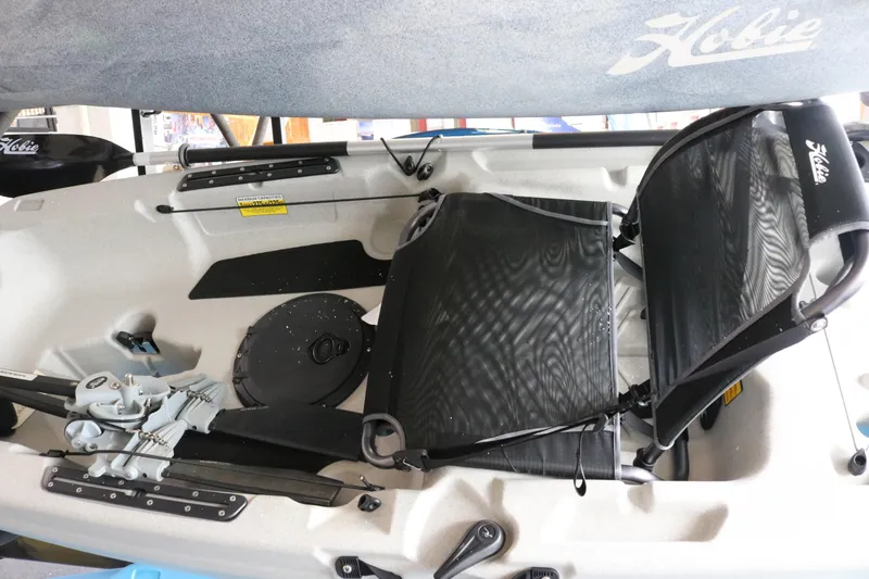 Slide: The Image of 2023 Hobie Mirage Passport 12.0 R kayak interior with pedal drive system and seating. - 2
