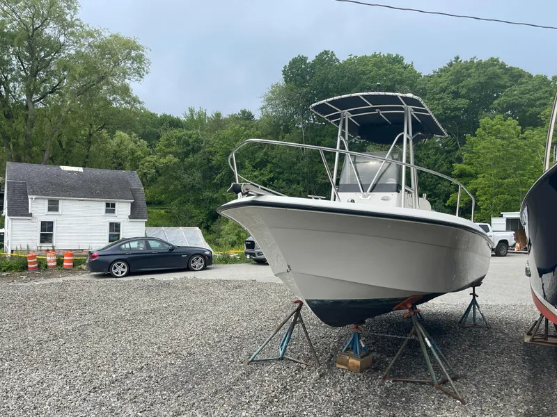 The Image of 2005 Hydra-Sports Lightning 212 CC boat on stands in a gravel lot. - 0