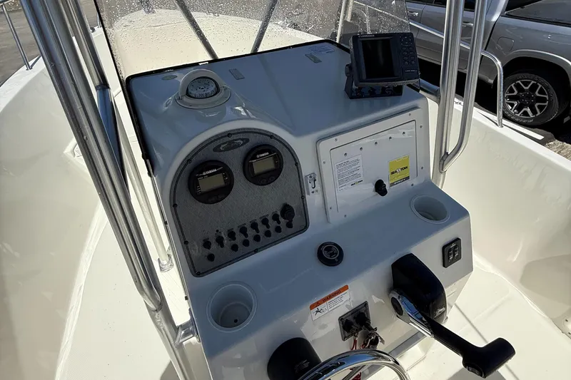 Slide: The Image of 2005 Hydra-Sports Lightning 212 CC boat console with gauges and navigation equipment. - 10