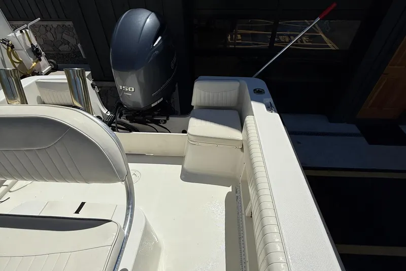 Slide: The Image of 2005 Hydra-Sports Lightning 212 CC boat interior with Yamaha 150 engine. - 11