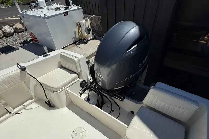 Slide: The Image of 2005 Hydra-Sports Lightning 212 CC boat with Yamaha outboard motor, docked near fuel station. - 12