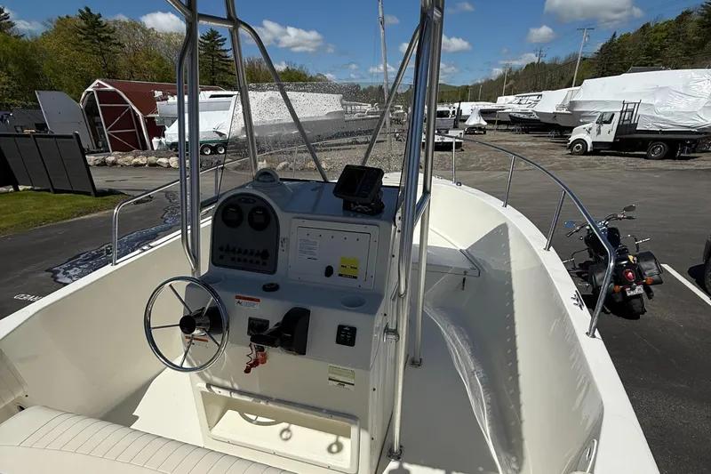 Slide: The Image of 2005 Hydra-Sports Lightning 212 CC boat interior with steering wheel and control panel. - 8