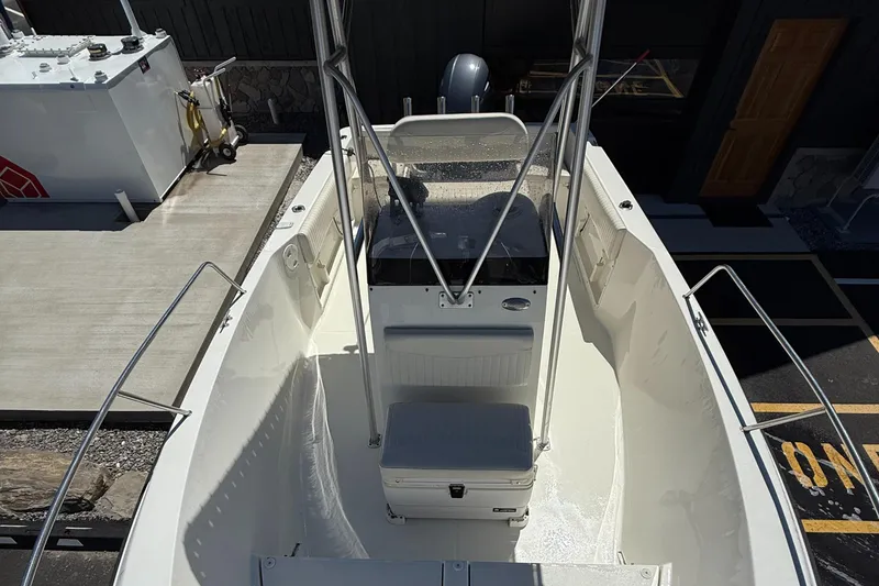 Slide: The Image of 2005 Hydra-Sports Lightning 212 CC boat interior with seating and console, viewed from above. - 9