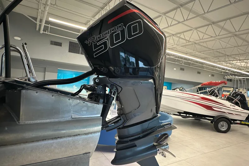 Slide: The Image of 2025 Veranda VX 27 DCRC with powerful Racing 500 outboard motor in showroom. - 3