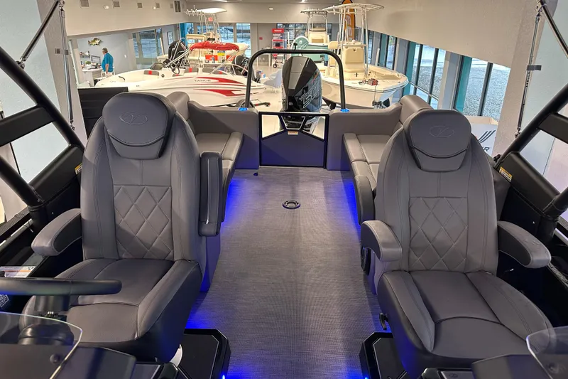 Slide: The Image of 2025 Veranda VX 27 DCRC boat interior with luxurious seating and ambient lighting. - 7