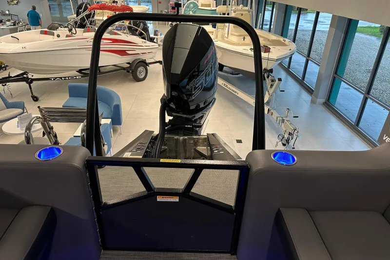 Slide: The Image of 2025 Veranda VX 27 DCRC boat interior with motor, showroom display. - 9